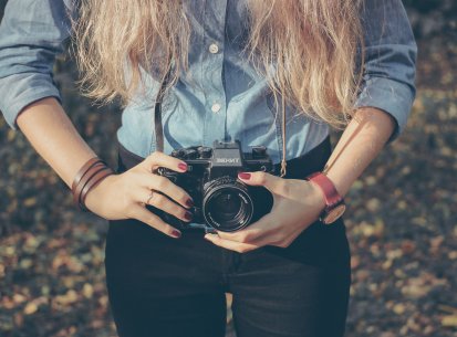 Woman with vintage retro camera